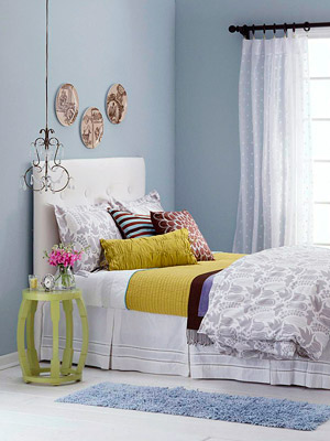 bedroom w/pale blue walls and lime green accents