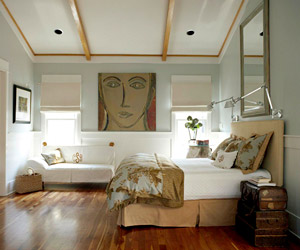 contemporary bedroom w/large artwork on back wall
