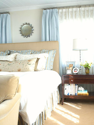 bedroom w/sund mirror above bed