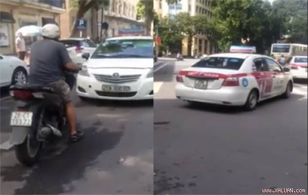 Chiếc taxi bị người đàn ông di xe SH bắt lùi hàng trăm mét. Ảnh cắt từ video Otofun