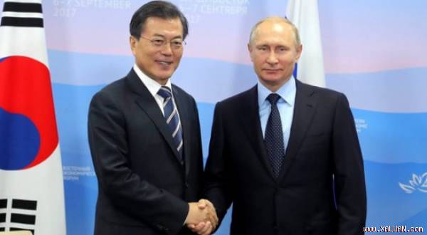 Hai vị Tổng thống Hàn-Nga bắt tay-Ảnh: Getty Images