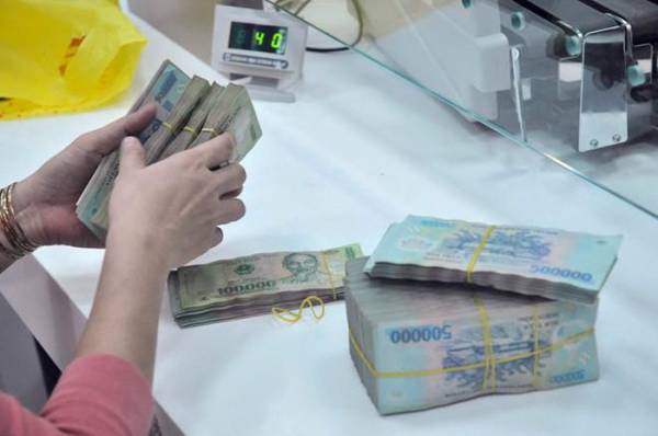 Cổ đông nhiều doanh nghiệp sắp nhận cổ tức năm 2018 - Ảnh: Gia Khiêm