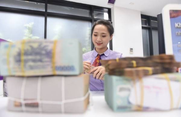 Tín dụng tăng thấp, vốn dồi dào giúp giải tỏa áp lực tăng lãi suất huy động cuối năm