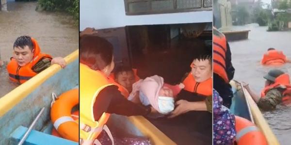 Xúc động hình ảnh Công an xã lội nước sâu đẩy xuồng cứu cháu bé sơ sinh khỏi lũ dữ